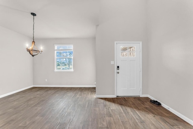 foyer with a chandelier and hardwood / wood-style flooring