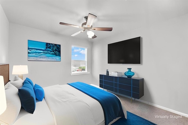 carpeted bedroom featuring ceiling fan