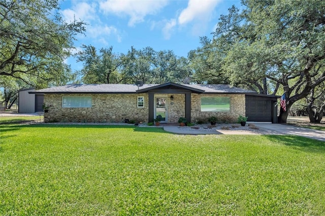 ranch-style home with a front yard and a garage