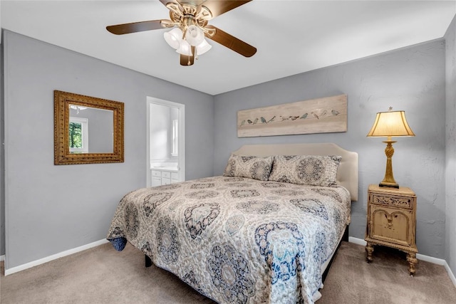 carpeted bedroom featuring ensuite bath and ceiling fan