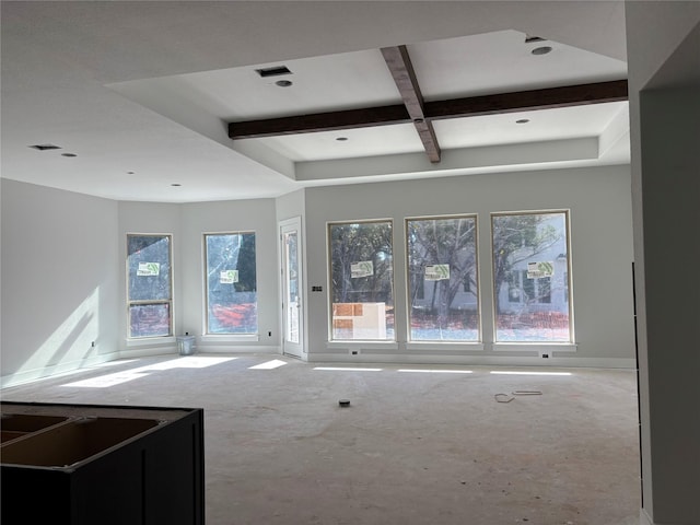 unfurnished living room featuring beamed ceiling and coffered ceiling