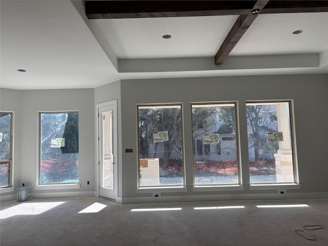 interior space with a wealth of natural light and beam ceiling