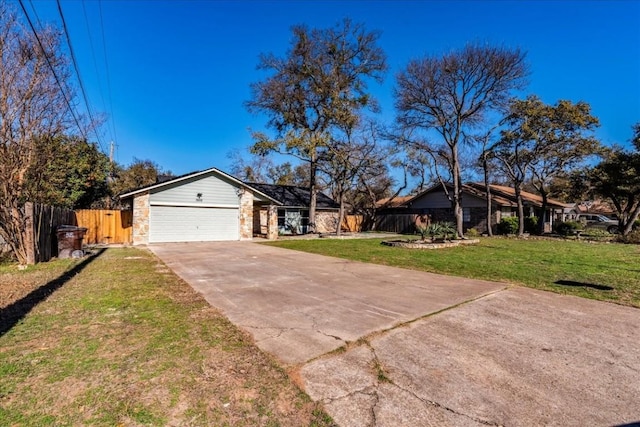 view of front facade featuring a garage and a front yard