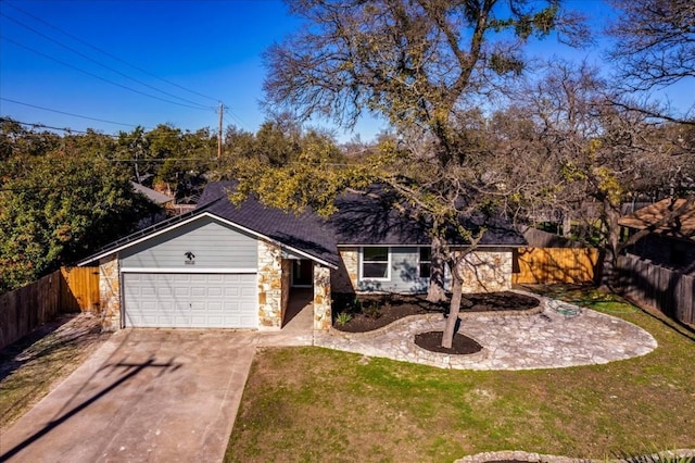 single story home with a front yard and a garage