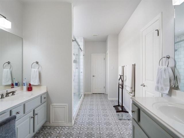 bathroom with tile patterned flooring, vanity, and an enclosed shower