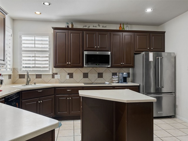 kitchen featuring sink, decorative backsplash, light tile patterned floors, dark brown cabinets, and stainless steel appliances