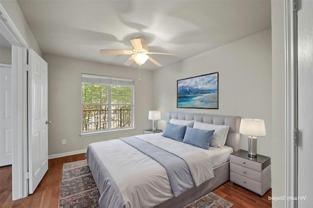 bedroom featuring ceiling fan and dark hardwood / wood-style flooring