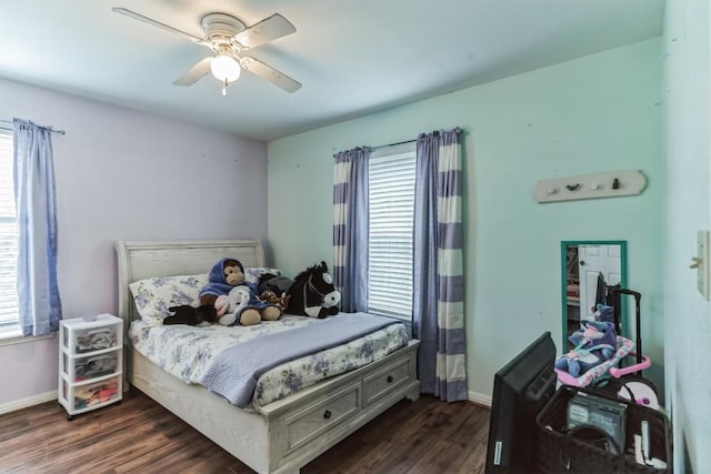 bedroom with ceiling fan and dark hardwood / wood-style floors