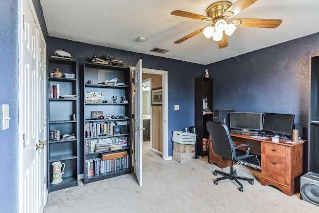 office space featuring ceiling fan and carpet floors