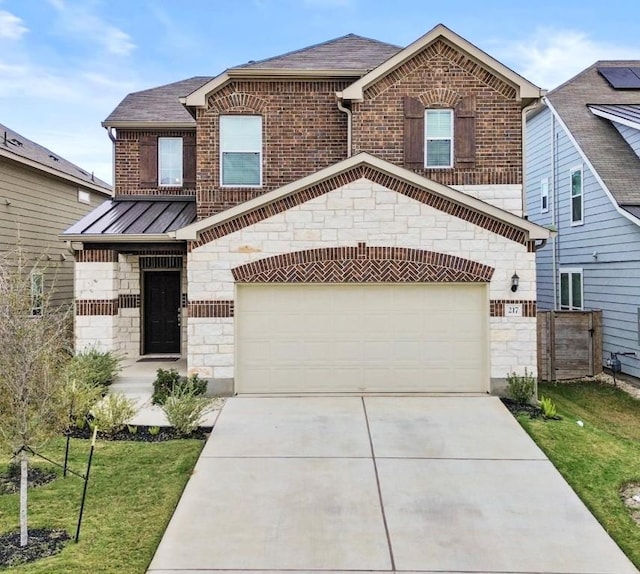 view of front of house with a garage and a front lawn