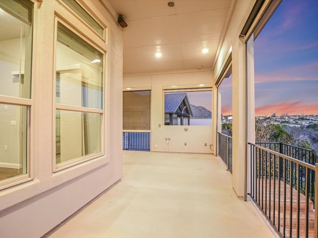 view of balcony at dusk