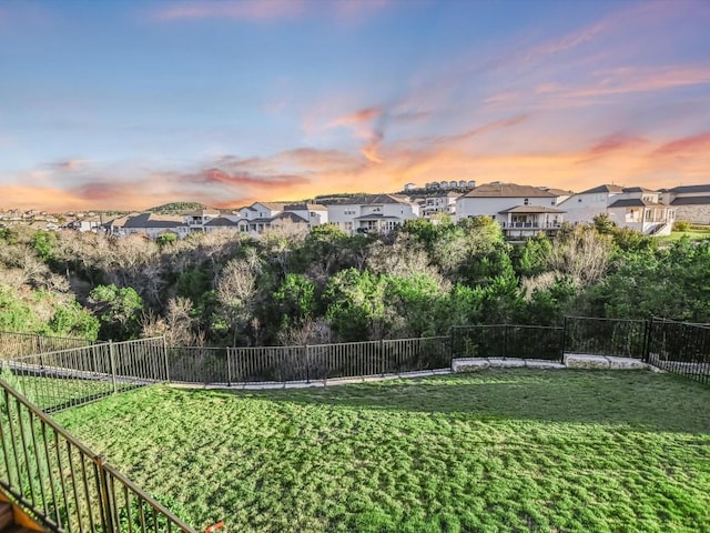 view of yard at dusk