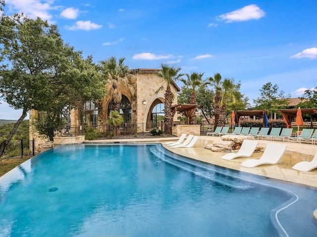 view of swimming pool with a patio