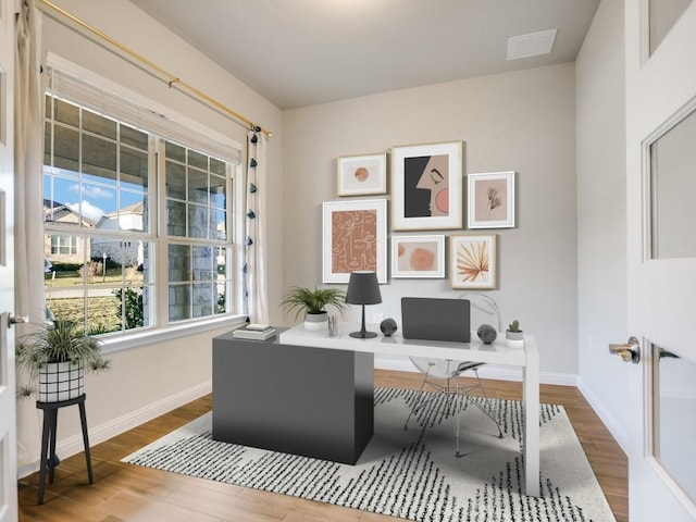 home office with hardwood / wood-style floors