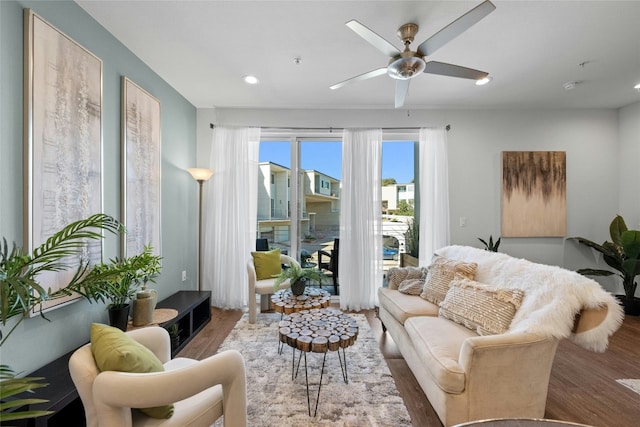 sitting room featuring ceiling fan and hardwood / wood-style floors