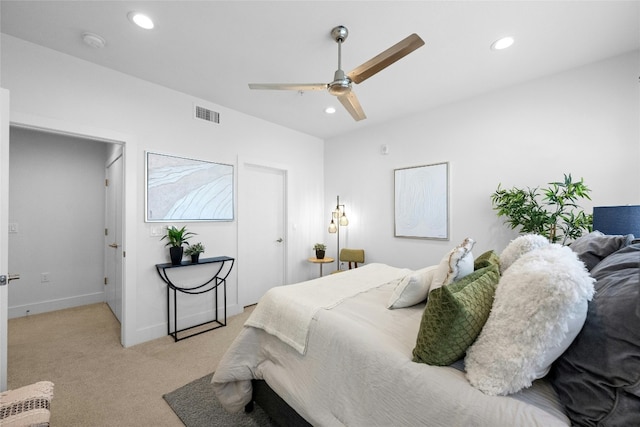 bedroom featuring light colored carpet and ceiling fan