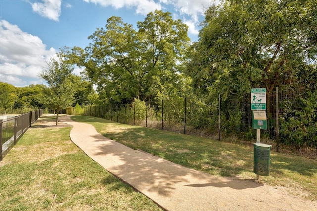 view of property's community with a lawn