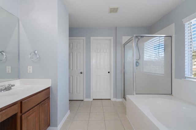 bathroom featuring tile patterned flooring, vanity, and separate shower and tub