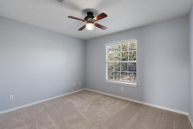 carpeted empty room with ceiling fan