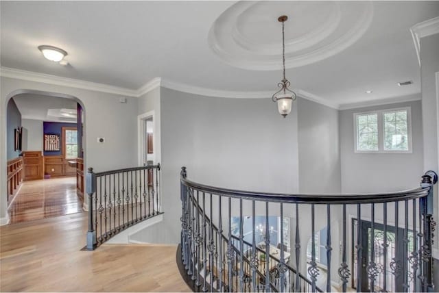 corridor featuring light hardwood / wood-style flooring and ornamental molding