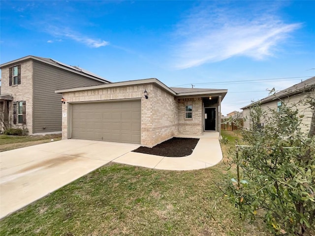 view of front of home featuring a front yard and a garage