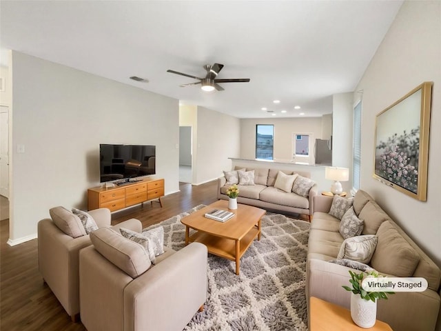 living room with hardwood / wood-style flooring and ceiling fan