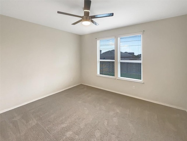 carpeted empty room featuring ceiling fan