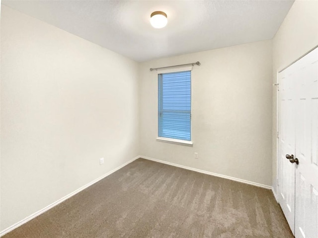 unfurnished room with carpet