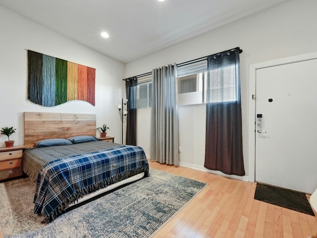 bedroom with hardwood / wood-style flooring