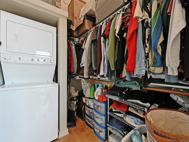 interior space featuring light hardwood / wood-style flooring and stacked washer and clothes dryer