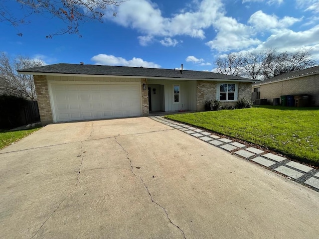 ranch-style home with a garage and a front yard