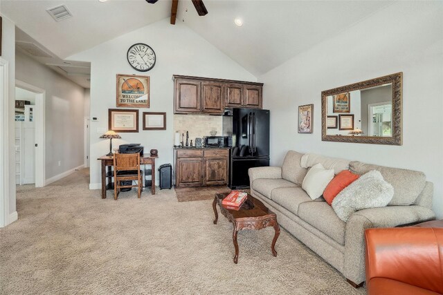 living room featuring light carpet, beam ceiling, high vaulted ceiling, and ceiling fan