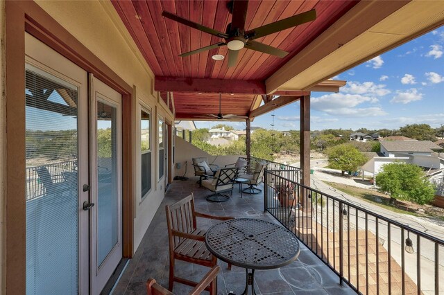 balcony featuring ceiling fan