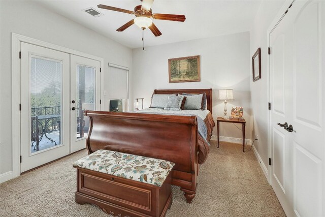 carpeted bedroom with access to outside, ceiling fan, and french doors