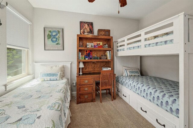 bedroom with light carpet and ceiling fan