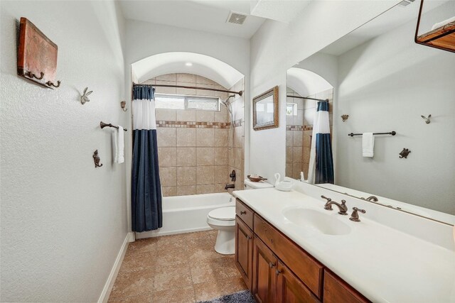 full bathroom featuring vanity, toilet, and shower / bath combo with shower curtain