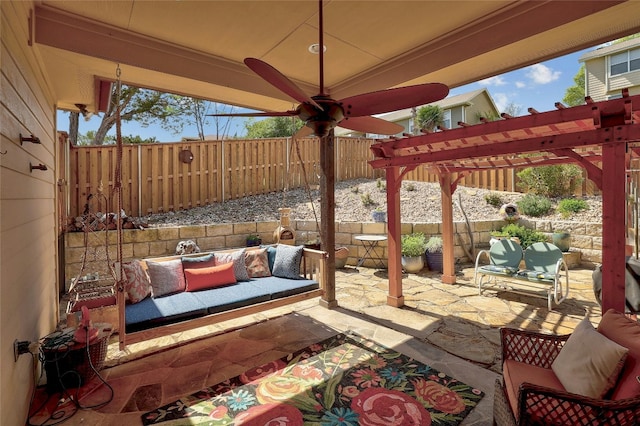 view of patio / terrace with an outdoor living space, ceiling fan, and a pergola