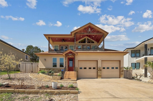 view of front of home with ceiling fan, a balcony, and a garage