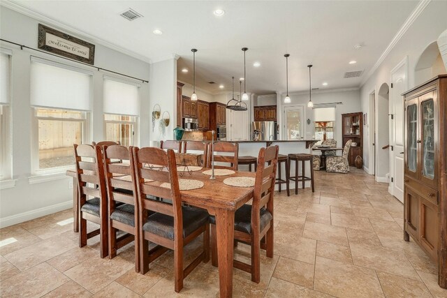 dining room with crown molding