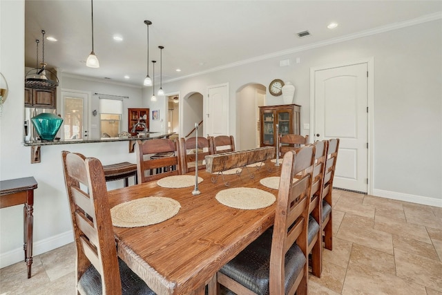 dining area with crown molding