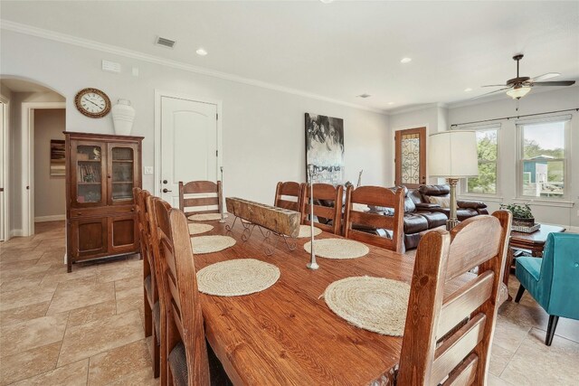 dining room featuring ceiling fan and crown molding