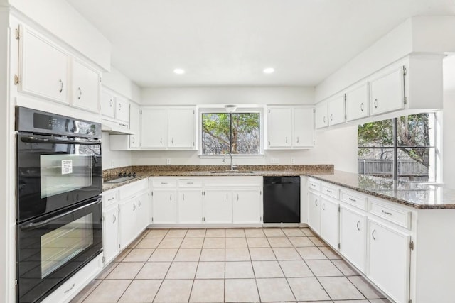 kitchen featuring black appliances, white cabinets, sink, dark stone countertops, and kitchen peninsula