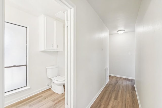 corridor featuring light hardwood / wood-style flooring