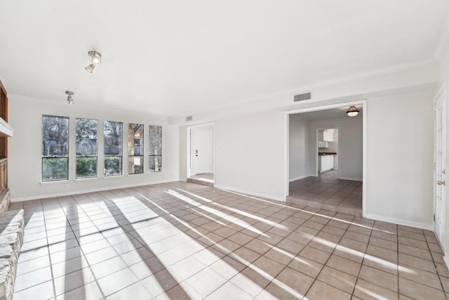 unfurnished living room featuring light tile patterned flooring