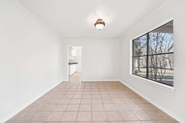 spare room with light tile patterned floors and crown molding