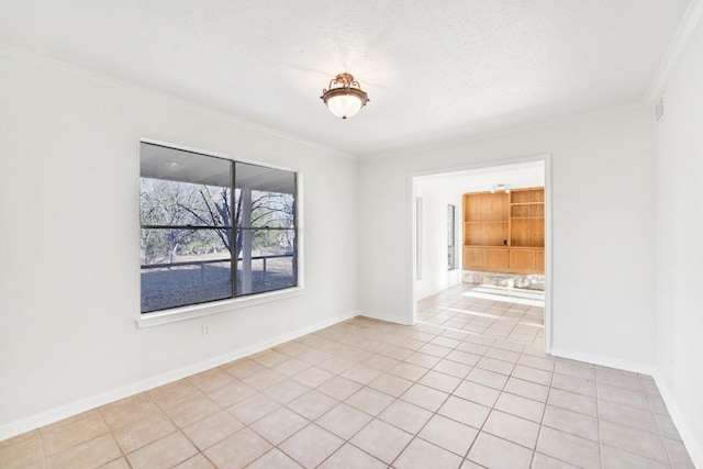 unfurnished room featuring a textured ceiling, ornamental molding, and light tile patterned flooring