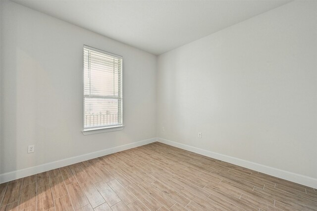 spare room featuring light hardwood / wood-style flooring