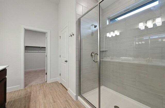 bathroom featuring vanity and an enclosed shower