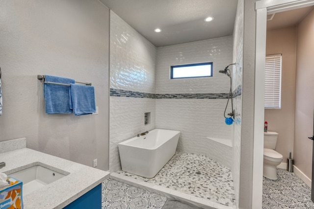 full bathroom featuring separate shower and tub, tile patterned floors, vanity, and toilet