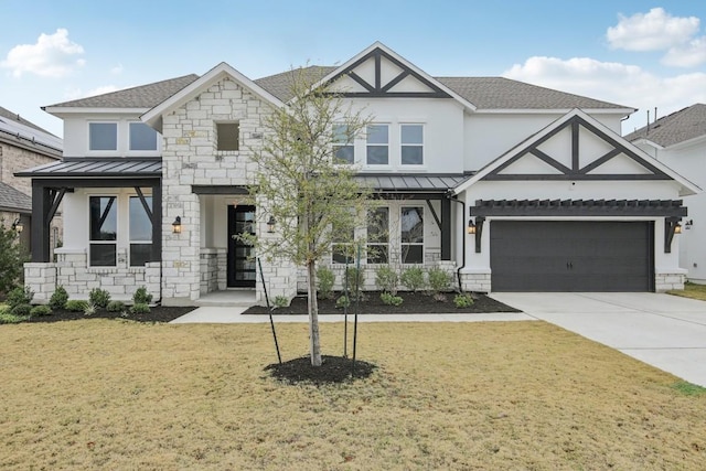 view of front of house with a front lawn and a garage